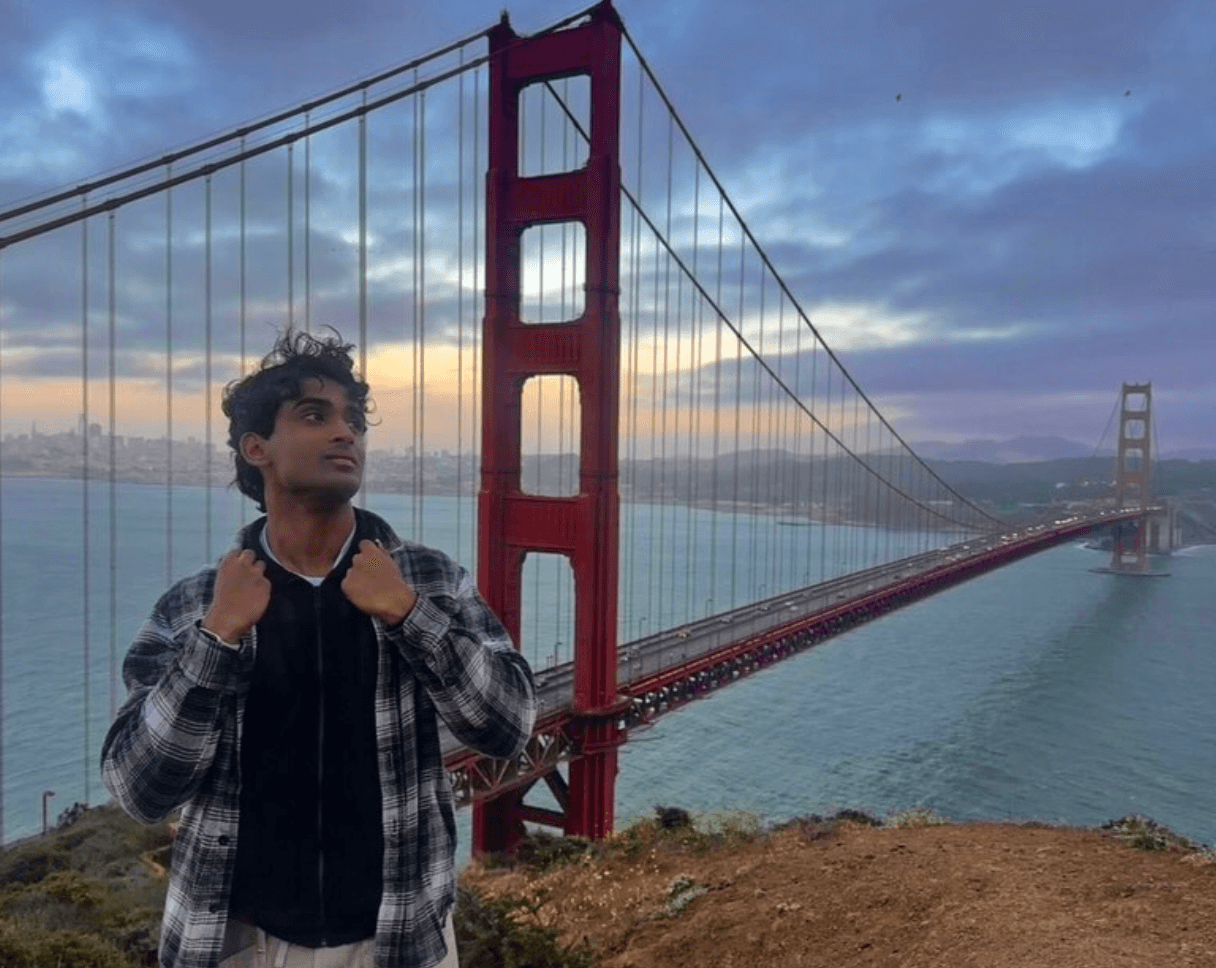 Ritviik standing near the Golden Gate Bridge at dusk